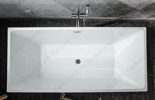 Freestanding rectangular bathtub with freestanding tub faucet