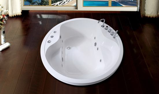 Round soaking soft tub in bathroom